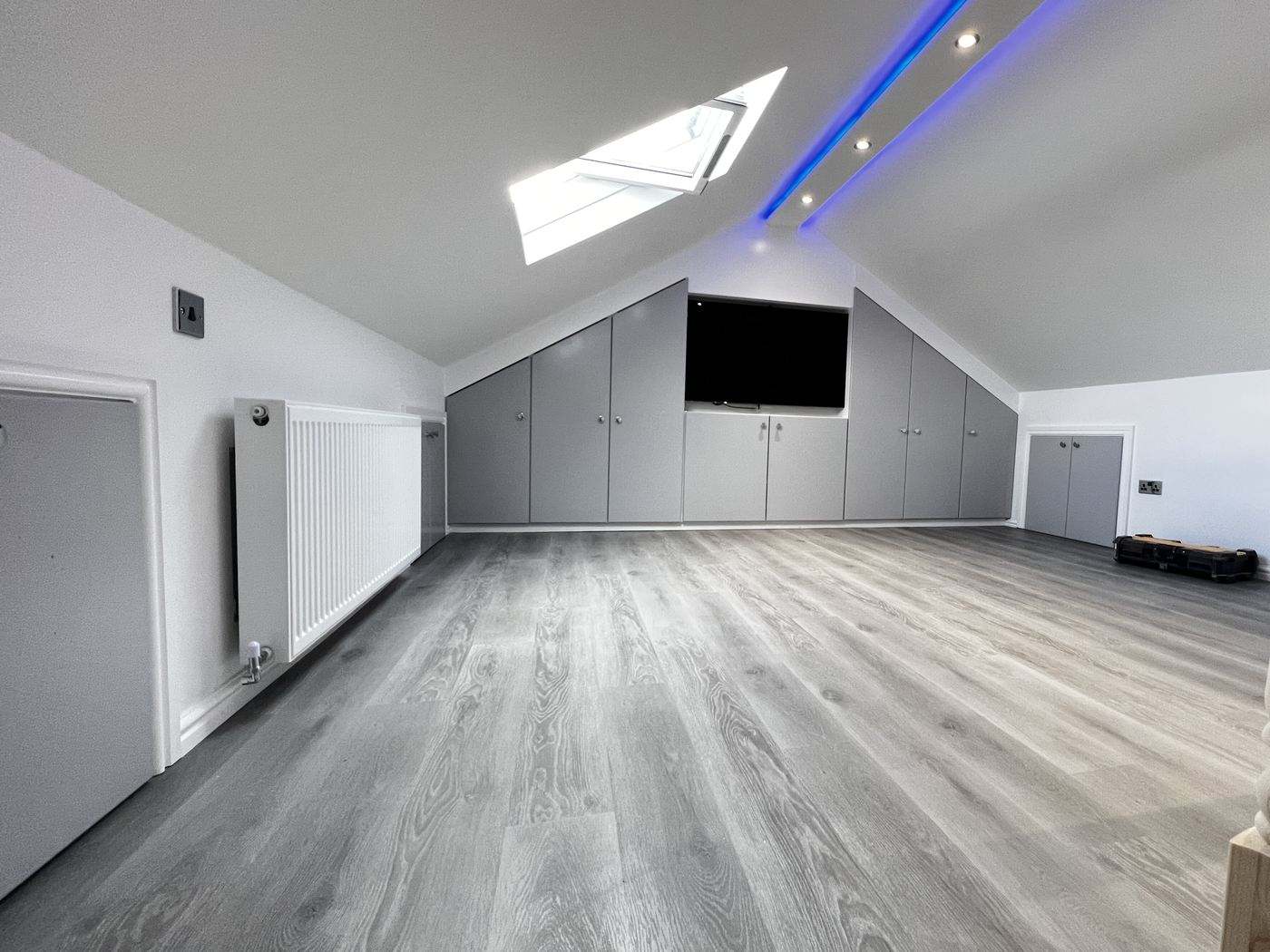 Finished loft conversion with vaulted ceiling, velux window and fitted wardrobes